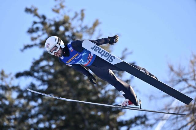 Bulgaria's Vladimir Zografski soars through the air during the training round of the Men's Individual Large Hill HS128 event of the FIS Ski Jumping World Cup, the third leg of the Four Hills Tournament, in Innsbruck, Austria on January 3, 2026. (Photo by KERSTIN JOENSSON / AFP)