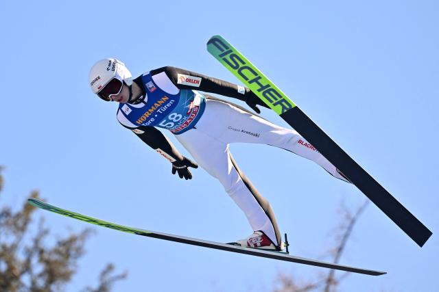Poland's Kacper Tomasiak soars through the air during the training round of the Men's Individual Large Hill HS128 event of the FIS Ski Jumping World Cup, the third leg of the Four Hills Tournament, in Innsbruck, Austria on January 3, 2026. (Photo by KERSTIN JOENSSON / AFP)