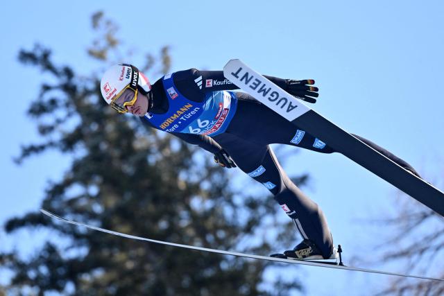 Germany's Philipp Raimund soars through the air during the training round of the Men's Individual Large Hill HS128 event of the FIS Ski Jumping World Cup, the third leg of the Four Hills Tournament, in Innsbruck, Austria on January 3, 2026. (Photo by KERSTIN JOENSSON / AFP)