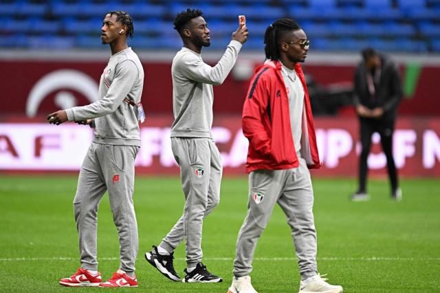 Sudan's players arrive on the picth before the Africa Cup of Nations (CAN) round of 16 football match between Senegal and Sudan at Grand Stadium in Tangiers on January 3, 2026. (Photo by Gabriel BOUYS / AFP)