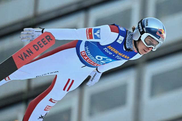Austria's Daniel Tschofenig soars through the air during the qualification round of the Men's Individual Large Hill HS128 event of the FIS Ski Jumping World Cup, the third leg of the Four Hills Tournament, in Innsbruck, Austria on January 3, 2026. (Photo by KERSTIN JOENSSON / AFP)