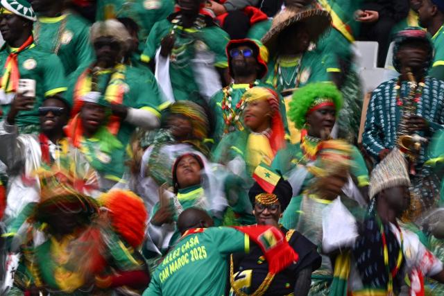 Senegal's supporters cheer before the Africa Cup of Nations (CAN) round of 16 football match between Senegal and Sudan at Grand Stadium in Tangiers on January 3, 2026. (Photo by Gabriel BOUYS / AFP)