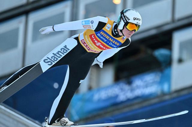 Slovenia's Domen Prevc soars through the air during the qualification round of the Men's Individual Large Hill HS128 event of the FIS Ski Jumping World Cup, the third leg of the Four Hills Tournament, in Innsbruck, Austria on January 3, 2026. (Photo by KERSTIN JOENSSON / AFP)