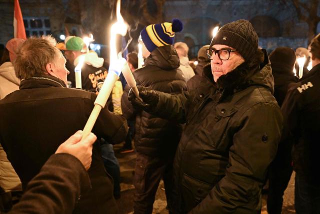 Hungarian and Slovakian members of civil society organizations, university students and their sympathisers attend a demonstration in front of the Slovak embassy in Budapest to protest recent Slovak legislative changes affecting members of the Hungarian minority in Slovakia on January 3, 2026. (Photo by Attila KISBENEDEK / AFP)