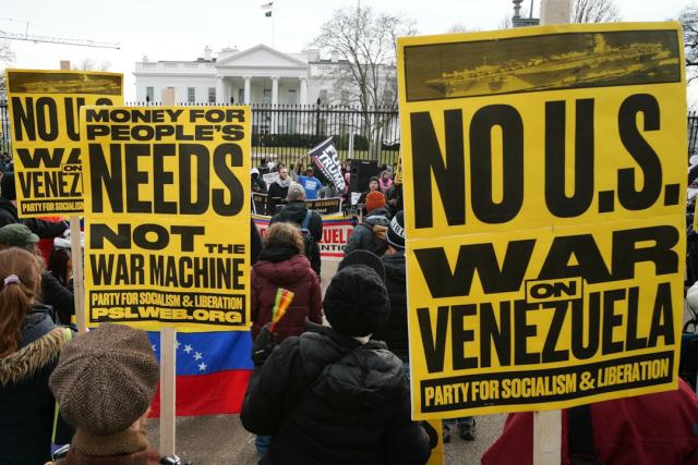 People take part in a demonstration against US military action in Venezuela in front of the White House in Washington, DC, on January 3, 2026. US President Donald Trump said Saturday that the United States will "run" Venezuela and tap its huge oil reserves after snatching leftist leader Nicolas Maduro out of the country during a bombing raid on Caracas. Trump's announcement came hours after a lightning attack in which special forces grabbed Maduro and his wife, while airstrikes pounded multiple sites, stunning the capital city. (Photo by Mandel NGAN / AFP)