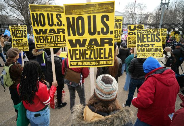 People take part in a demonstration against US military action in Venezuela in front of the White House in Washington, DC, on January 3, 2026. US President Donald Trump said Saturday that the United States will "run" Venezuela and tap its huge oil reserves after snatching leftist leader Nicolas Maduro out of the country during a bombing raid on Caracas. Trump's announcement came hours after a lightning attack in which special forces grabbed Maduro and his wife, while airstrikes pounded multiple sites, stunning the capital city. (Photo by Mandel NGAN / AFP)