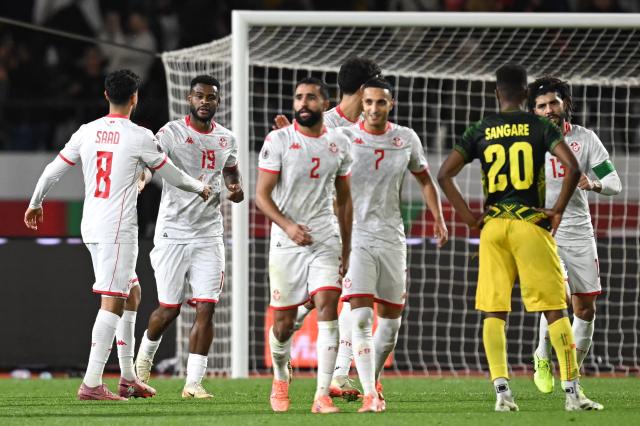 Tunisia's forward #19 Firas Chaouat (2 L) celebrates scoring his team's first goal during the Africa Cup of Nations (CAN) round of 16 football match between Mali and Tunisia at Mohammed V Stadium in Casablanca on January 3, 2026. (Photo by Paul ELLIS / AFP)