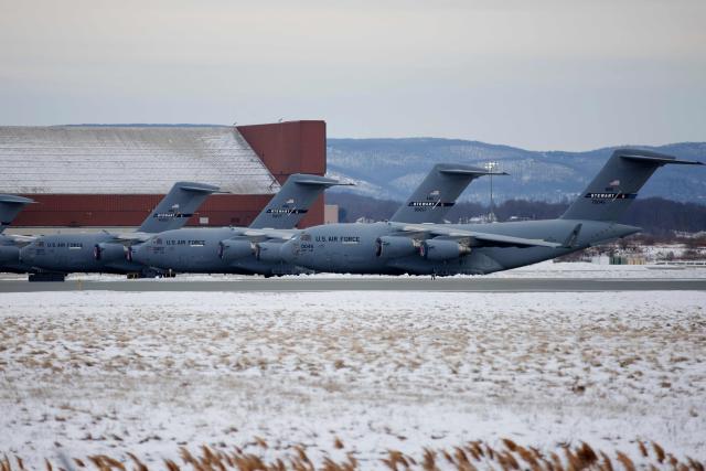 US Air Force planes sit on the tarmac at Stewart Air National Guard Base in Newburgh, New York, on January 3. 2026. US President Donald Trump said Saturday that the United States will "run" Venezuela and tap its huge oil reserves after snatching leftist leader Nicolas Maduro out of the country during a bombing raid on Caracas. Trump's announcement came hours after a lightning attack in which special forces grabbed Maduro and his wife, while airstrikes pounded multiple sites, stunning the capital city. (Photo by Leonardo Munoz / AFP)