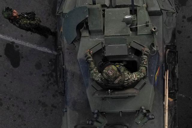 This aerial view shows a Colombian soldier in a military vehicle monitoring the border crossing with Venezuela in Cucuta, Colombia, on January 3, 2026, after US forces captured Venezuela's President Nicolas Maduro. President Donald Trump said on January 3, 2025, that US forces had captured Venezuela's leader Nicolas Maduro after bombing the capital Caracas and other cities in a dramatic climax to a months-long standoff between Trump and his Venezuelan arch-foe. (Photo by Raul ARBOLEDA / AFP)