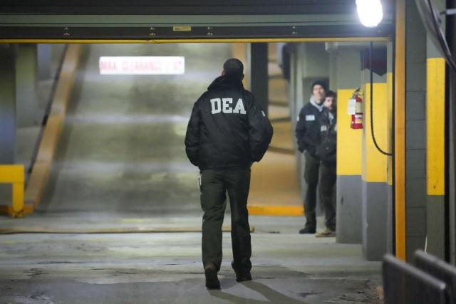 DEA agents wait at the US Drug Enforcement Administration (DEA) headquarters in lower Manhattan as Venezuelan President Nicolas Maduro is expected to be transferred on January 3, 2026. Venezuelan President Nicolas Maduro arrived on the evening of January 3 at a military base in the United States after his capture by US forces in Caracas. Maduro was seen surrounded by FBI agents as he descended the boarding stairs of a US government plane at a New York state National Guard facility, and was slowly escorted along the tarmac. (Photo by Bryan R. SMITH / AFP)