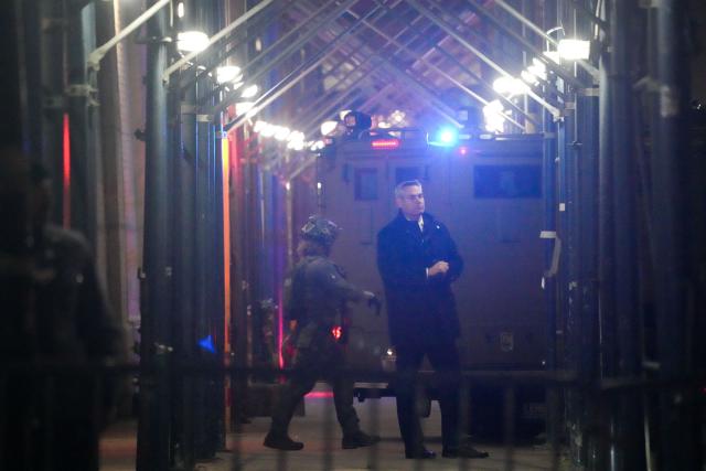 An armored vehicle backs in at the US Drug Enforcement Administration (DEA) headquarters in lower Manhattan as Venezuelan President Nicolas Maduro is expected to be transferred on January 3, 2026. Venezuelan President Nicolas Maduro arrived on the evening of January 3 at a military base in the United States after his capture by US forces in Caracas. Maduro was seen surrounded by FBI agents as he descended the boarding stairs of a US government plane at a New York state National Guard facility, and was slowly escorted along the tarmac. (Photo by Bryan R. SMITH / AFP)