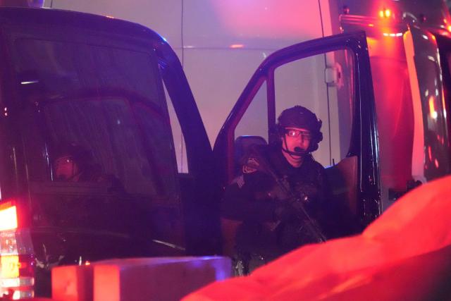 An officer in tactical gear steps off a vehicle outside the US Drug Enforcement Administration (DEA) headquarters in lower Manhattan as Venezuelan President Nicolas Maduro is expected to be transferred on January 3, 2026. Venezuelan President Nicolas Maduro arrived on the evening of January 3 at a military base in the United States after his capture by US forces in Caracas. Maduro was seen surrounded by FBI agents as he descended the boarding stairs of a US government plane at a New York state National Guard facility, and was slowly escorted along the tarmac. (Photo by Bryan R. SMITH / AFP)
