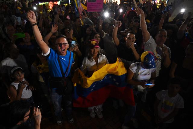 Venezuelans living in Colombia celebrate in Cucuta, Colombia, on January 3, 2026, after US forces captured Venezuelan leader Nicolas Maduro. President Donald Trump said on January 3, 2026, that US forces had captured Venezuela's leader Nicolas Maduro after bombing the capital Caracas and other cities in a dramatic climax to a months-long standoff between Trump and his Venezuelan arch-foe. (Photo by Raul ARBOLEDA / AFP)