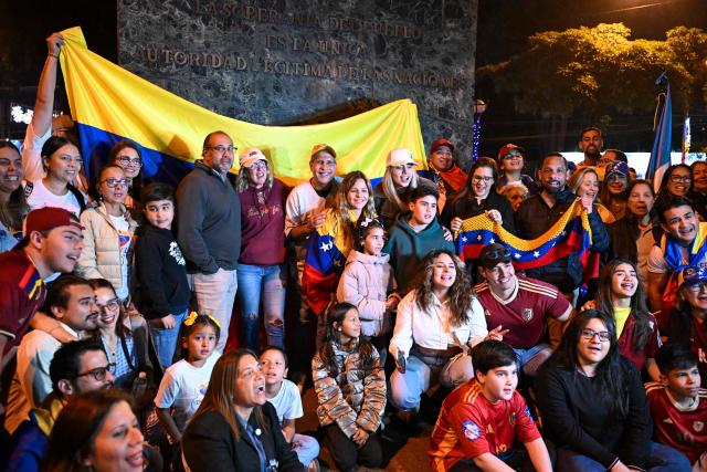 Venezuelans living in Guatemala celebrate at Simon Bolivar Square in Guatemala City on January 3, 2026, after US forces captured Venezuelan leader Nicolas Maduro. President Donald Trump said on January 3, 2026, that US forces had captured Venezuela's leader Nicolas Maduro after bombing the capital Caracas and other cities in a dramatic climax to a months-long standoff between Trump and his Venezuelan arch-foe. (Photo by JOHAN ORDONEZ / AFP)