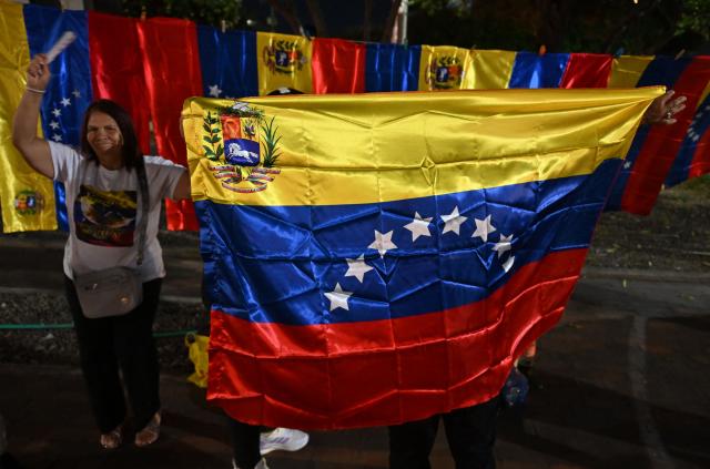 Venezuelans living in Colombia celebrate in Cucuta, Colombia, on January 3, 2026, after US forces captured Venezuelan leader Nicolas Maduro. President Donald Trump said on January 3, 2026, that US forces had captured Venezuela's leader Nicolas Maduro after bombing the capital Caracas and other cities in a dramatic climax to a months-long standoff between Trump and his Venezuelan arch-foe. (Photo by Raul ARBOLEDA / AFP)