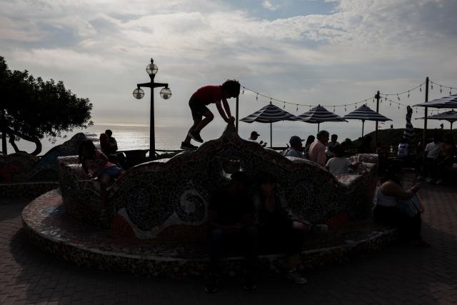 A kid plays at the Love Park in Miraflores, Lima, on January 3, 2026. (Photo by Connie FRANCE / AFP)