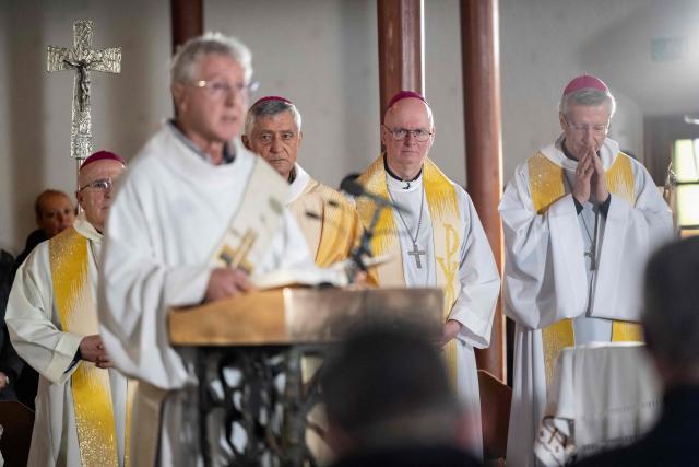 (From rear L) Bishops Joseph Maria Bonnemain, Jean-Marie Lovey, Charles Morerod and Alain de Raemy attend a Sunday mass dedicated to the victims of the fire at the 'Le Constellation' bar and lounge, at the Catholic Chapel of Saint-Christophe in Crans-Montana, on January 4, 2026. Authorities investigating the New Year's blaze in the Swiss resort of Crans-Montana have identified 24 of the 40 people killed, including 11 minors and six foreign nationals, police said on January 4, 2026. Also 119 were injured during the fire, most of them seriously, according to the latest toll. (Photo by JEAN-CHRISTOPHE BOTT / POOL / AFP)