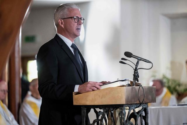 Head of the Reformed Church of the Canton of Valais Stephan Kronbichler speaks during a Sunday mass dedicated to the victims of the fire at the 'Le Constellation' bar and lounge, at the Catholic Chapel of Saint-Christophe in Crans-Montana, on January 4, 2026. Authorities investigating the New Year's blaze in the Swiss resort of Crans-Montana have identified 24 of the 40 people killed, including 11 minors and six foreign nationals, police said on January 4, 2026. Also 119 were injured during the fire, most of them seriously, according to the latest toll. (Photo by JEAN-CHRISTOPHE BOTT / POOL / AFP)