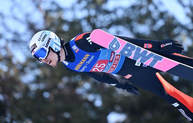 Norway's Johann Andre Forfang soars through the air during the trial round for the Men's Individual Large Hill HS128 event of the FIS Ski Jumping World Cup, the third leg of the Four Hills Tournament, in Innsbruck, Austria on January 4 , 2026. (Photo by KERSTIN JOENSSON / AFP)