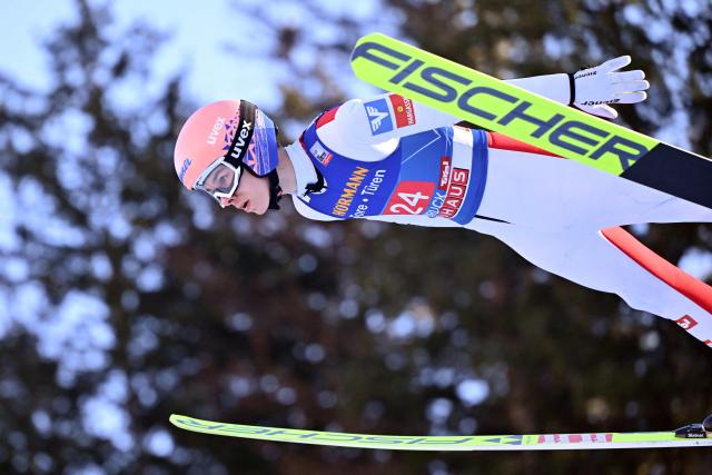 Austria's Maximilian Ortner soars through the air during the trial round for the Men's Individual Large Hill HS128 event of the FIS Ski Jumping World Cup, the third leg of the Four Hills Tournament, in Innsbruck, Austria on January 4 , 2026. (Photo by KERSTIN JOENSSON / AFP)
