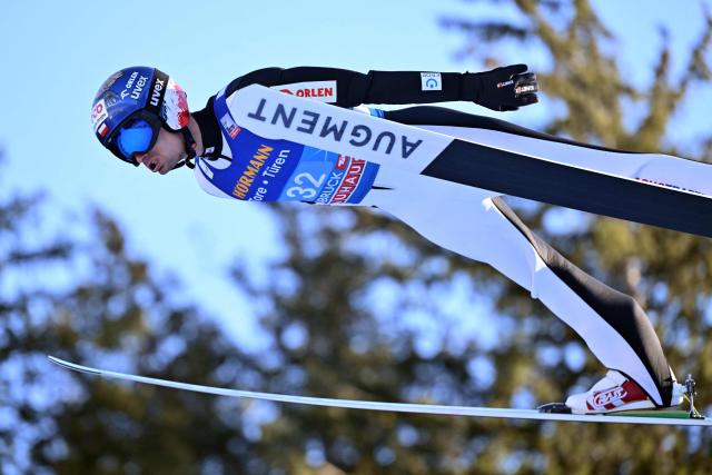 Poland's Maciej Kot soars through the air during the trial round for the Men's Individual Large Hill HS128 event of the FIS Ski Jumping World Cup, the third leg of the Four Hills Tournament, in Innsbruck, Austria on January 4 , 2026. (Photo by KERSTIN JOENSSON / AFP)