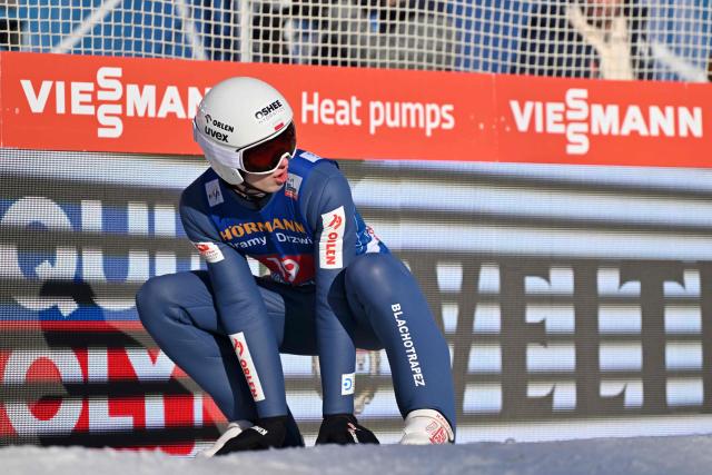 Poland's Kacper Tomasiak reacts after his jump during the first round of the Men's Individual Large Hill HS128 event of the FIS Ski Jumping World Cup, the third leg of the Four Hills Tournament, in Innsbruck, Austria on January 4 , 2026. (Photo by KERSTIN JOENSSON / AFP)