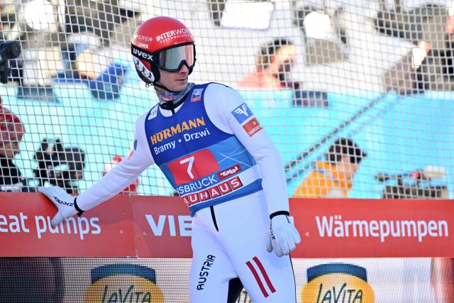 Austria's Manuel Fettner reacts after his jump during the first round of the Men's Individual Large Hill HS128 event of the FIS Ski Jumping World Cup, the third leg of the Four Hills Tournament, in Innsbruck, Austria on January 4 , 2026. (Photo by KERSTIN JOENSSON / AFP)