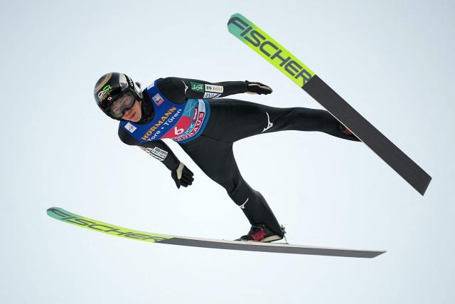 Japan's Ren Nikaido soars through the air during the first round of the Men's Individual Large Hill HS128 event of the FIS Ski Jumping World Cup, the third leg of the Four Hills Tournament, in Innsbruck, Austria on January 4 , 2026. (Photo by GEORG HOCHMUTH / APA / AFP) / Austria OUT