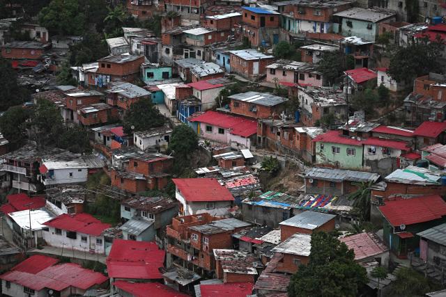 View of the San Agustin neighborghood in Caracas on January 4, 2026, a day after Venezuela's president Nicolas Maduro was captured in a US strike. A lingering smell of explosives hung over Venezuela's capital Caracas on Saturday as shocked residents took stock after an early-morning US strike that ousted strongman Nicolas Maduro. (Photo by Federico PARRA / AFP)