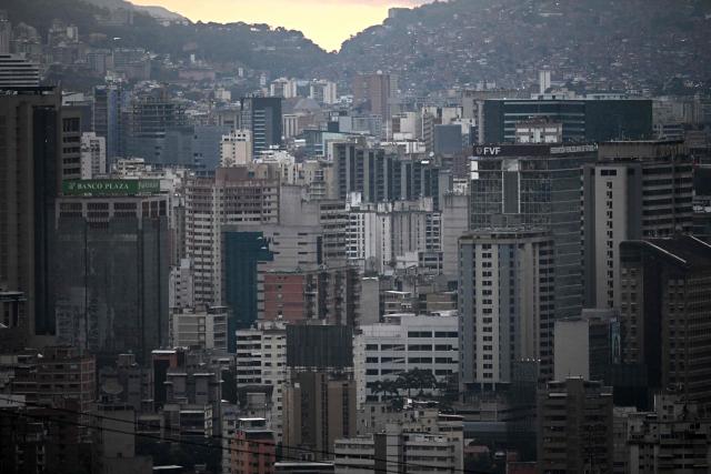 View of Caracas from the San Agustin neighborghood on January 4, 2026, a day after Venezuela's president Nicolas Maduro was captured in a US strike. A lingering smell of explosives hung over Venezuela's capital Caracas on Saturday as shocked residents took stock after an early-morning US strike that ousted strongman Nicolas Maduro. (Photo by Federico PARRA / AFP)