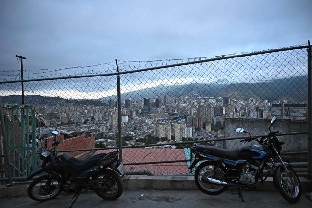 View of Caracas from the San Agustin neighborghood on January 4, 2026, a day after Venezuela's president Nicolas Maduro was captured in a US strike. A lingering smell of explosives hung over Venezuela's capital Caracas on Saturday as shocked residents took stock after an early-morning US strike that ousted strongman Nicolas Maduro. (Photo by Federico PARRA / AFP)