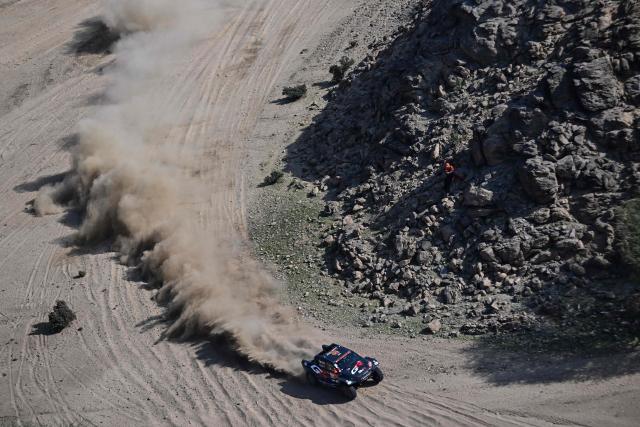 Toyota Gazoo Racing SA's South African driver Saood Variawa and French co-driver Francois Cazalet compete in the Stage 1 of the 48th edition of the Dakar Rally 2026, between Yanbu and Yanbu, Saudi Arabia, on January 4, 2026. (Photo by Giuseppe CACACE / AFP)