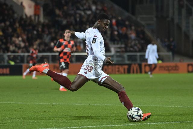 Metz's Senegalese defender #38 Sadibou Sane shoots the ball during the French L1 football match between FC Lorient and FC Metz at The Stade du Moustoir in Lorient, western France on January 4, 2026. (Photo by Damien Meyer / AFP)