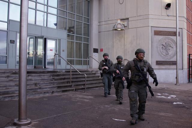 US Department of Justice federal officers stand guard outside the Metropolitan Detention Center, where ousted Venezuelan President Nicolas Maduro is being held, in the Brooklyn borough of New York City, on January 4, 2026. Venezuela's deposed president Nicolas Maduro is scheduled to appear before a federal judge in New York at noon on January 5, to be formally notified about the charges against him, the court said. Maduro and his wife, Cilia Flores, were seized by US forces during a pre-dawn raid on January 3 in Caracas and brought to New York to face charges of "narcoterrorism" tied to alleged trafficking of tons of cocaine into the United States. (Photo by Leonardo Munoz / AFP)