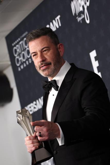 TV host Jimmy Kimmel poses in the press room with the Best Talk Show award for "Jimmy Kimmel Live!" during the 31st Annual Critics Choice Awards at Barker Hangar in Santa Monica, California, on January 4, 2026. (Photo by Michael Tran / AFP)