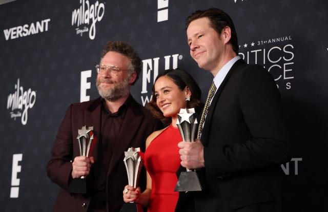 (L-R) Canadian-US actor Seth Rogen, US actress Chase Sui Wonders and US actor Ike Barinholtz, winners of the Best Comedy Series Award for "The Studio", pose in the press room during the 31st Annual Critics Choice Awards at Barker Hangar in Santa Monica, California, on January 4, 2026. (Photo by Michael Tran / AFP)