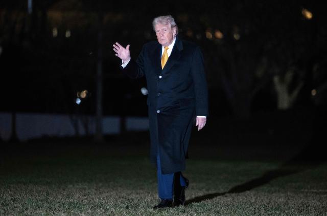US President Donald Trump waves to reporters upon his arrival to the White House in Washington, DC, on January 4, 2026. President Trump returned to DC after spending the holidays at his Mar-a-Lago residence in Palm Beach, Florida. (Photo by ANDREW CABALLERO-REYNOLDS / AFP)