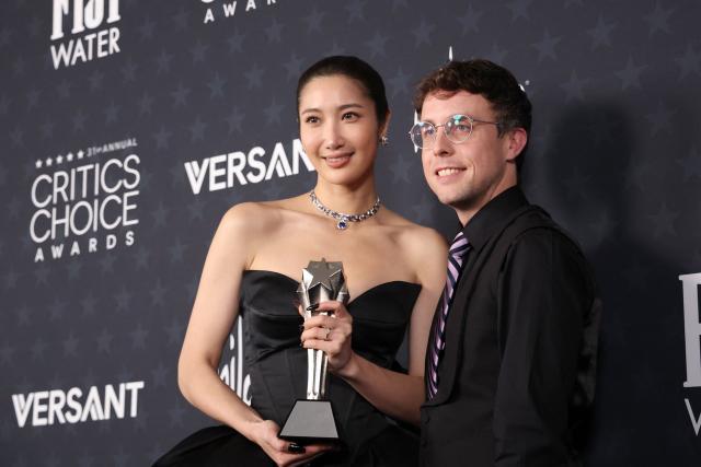 US singer EJAE and US composer Mark Sonnenblick pose in the press room with the Best Song award for "KPop Demon Hunters" during the 31st Annual Critics Choice Awards at Barker Hangar in Santa Monica, California, on January 4, 2026. (Photo by Michael Tran / AFP)