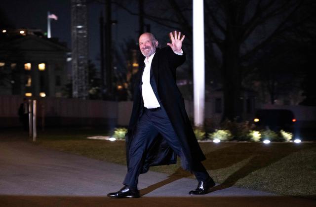 US Commerce Secretary Howard Lutnick waves to reporters after arriving with President Donald Trump back to the White House in Washington, DC, on January 4, 2026. President Trump returned to the White House after spending the holidays at his Mar-a-Lago residence in Palm Beach, Florida. (Photo by ANDREW CABALLERO-REYNOLDS / AFP)
