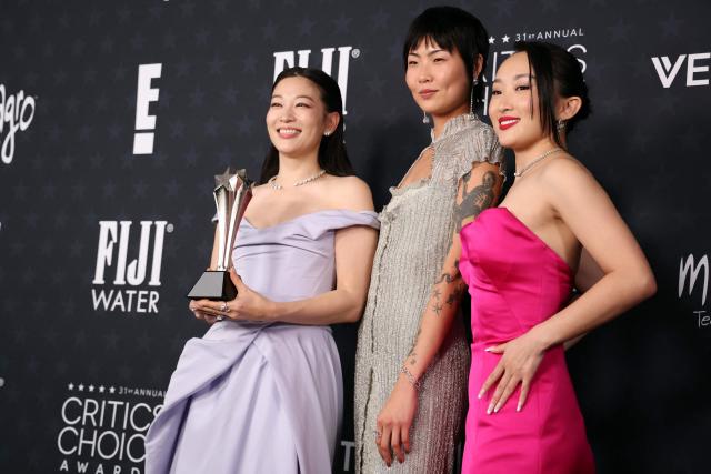 (L-R) Arden Cho, May Hong and Ji-young Yoo, winners of the Best Animated Feature Award for "KPop Demon Hunters", pose in the press room during the 31st Annual Critics Choice Awards at Barker Hangar in Santa Monica, California, on January 4, 2026. (Photo by Michael Tran / AFP)