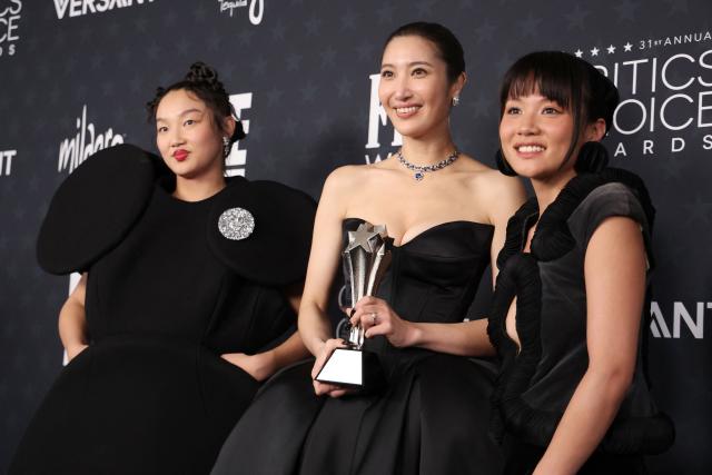 (L-R) US singer Audrey Nuna, US singer EJAE, and Rei Ami, winners of the Best Animated Feature Award for "KPop Demon Hunters", pose in the press during the 31st Annual Critics Choice Awards at Barker Hangar in Santa Monica, California, on January 4, 2026. (Photo by Michael Tran / AFP)