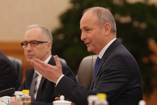 Ireland's Prime Minister Micheal Martin (R) talks to China's President Xi Jinping during a bilateral meeting at the Great Hall of the People in Beijing on January 5, 2026. (Photo by Andy Wong / POOL / AFP)