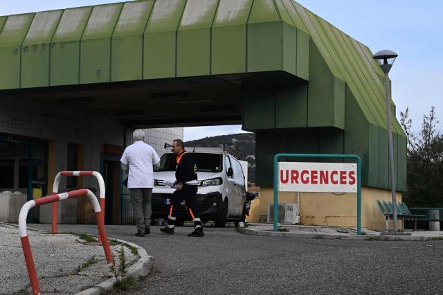 A photo shows the entrance to the emergency service of the Hyeres hospital after a fire broke out overnight killing one person in Hyeres, southeastern France, on January 5, 2026. A 75-year-old man died on January 5 morning in his cubicle while being treated by the emergency services in Hyeres, according to sources close to the case. The fire broke out at around 4 am and led to the evacuation of 32 people ‘horizontally,’ including 19 patients to the hospital's maternity ward, according to the fire department, which said the fire had been brought under control by a security guard and a caregiver. (Photo by Miguel MEDINA / AFP)