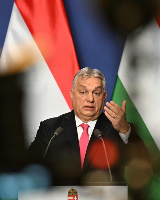 Hungary's Prime Minister Viktor Orban gestures as he addresses his annual press conference in the Carmelita Monastery, seat of the Hungarian premier, in Budapest, Hungary, on January 5, 2026. (Photo by Attila KISBENEDEK / AFP)