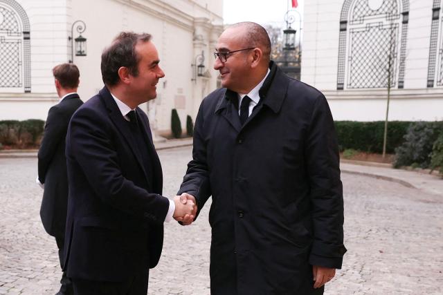 France's Prime Minister Sebastien Lecornu (L) listens to France's Interior Minister Laurent Nunez as he arrives to take part in a breakfast with ministers at French Interior ministry Hotel de Beauvau in Paris on January 5, 2026. (Photo by Thomas SAMSON / POOL / AFP)
