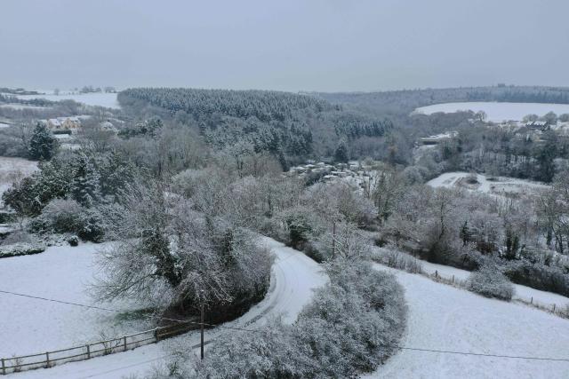 Snow blankets the town of Thury-Harcourt-le-Hom in Normandy, northwestern France, on January 5, 2026. (Photo by Lou BENOIST / AFP)