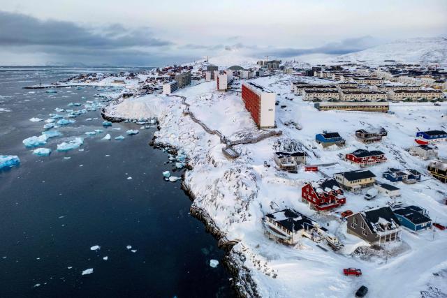 (FILES) This aerial view shows snow-covered buildings in Nuuk, Greenland, on March 7, 2025. Any US attack on a NATO ally would be the end of "everything", Denmark's Prime Minister Mette Frederiksen warned on January 5, 2026, after US President Donald Trump repeated his desire to annex Greenland. "If the United States decides to militarily attack another NATO country, then everything would stop -- that includes NATO and therefore post-World War II security," Frederiksen told Danish television network TV2. (Photo by Odd ANDERSEN / AFP)