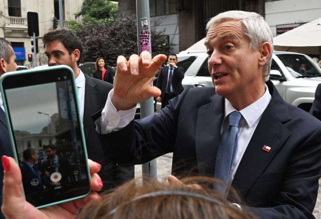 Chile's President-elect Jose Antonio Kast greets supporters after receiving the proclamation act at the Electoral Court in Santiago on January 5, 2026. (Photo by Rodrigo ARANGUA / AFP)