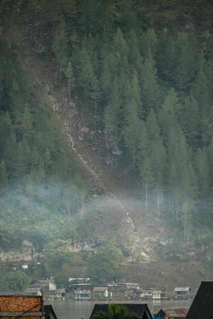 This photo shows a general view of residential houses near an area where a landslide took place following a flash flood in Takengon, Indonesia's Aceh province on January 6, 2025. (Photo by CHAIDEER MAHYUDDIN / AFP/Chaideer MAHYUDDIN / AFP)