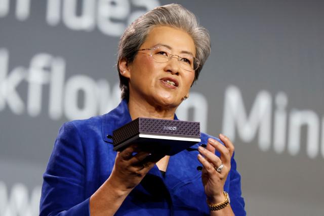 Lisa Su, chair and chief executive officer of Advanced Micro Devices Inc. (AMD), holds up the AMD Ryzen AI Halo, an AI developer platform, during an AMD news conference ahead of the annual Consumer Electronics Show in Las Vegas, Nevada, on January 5, 2026. (Photo by Caroline Brehman / AFP)
